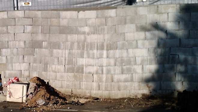 A wall with adecline that needs to be hidden